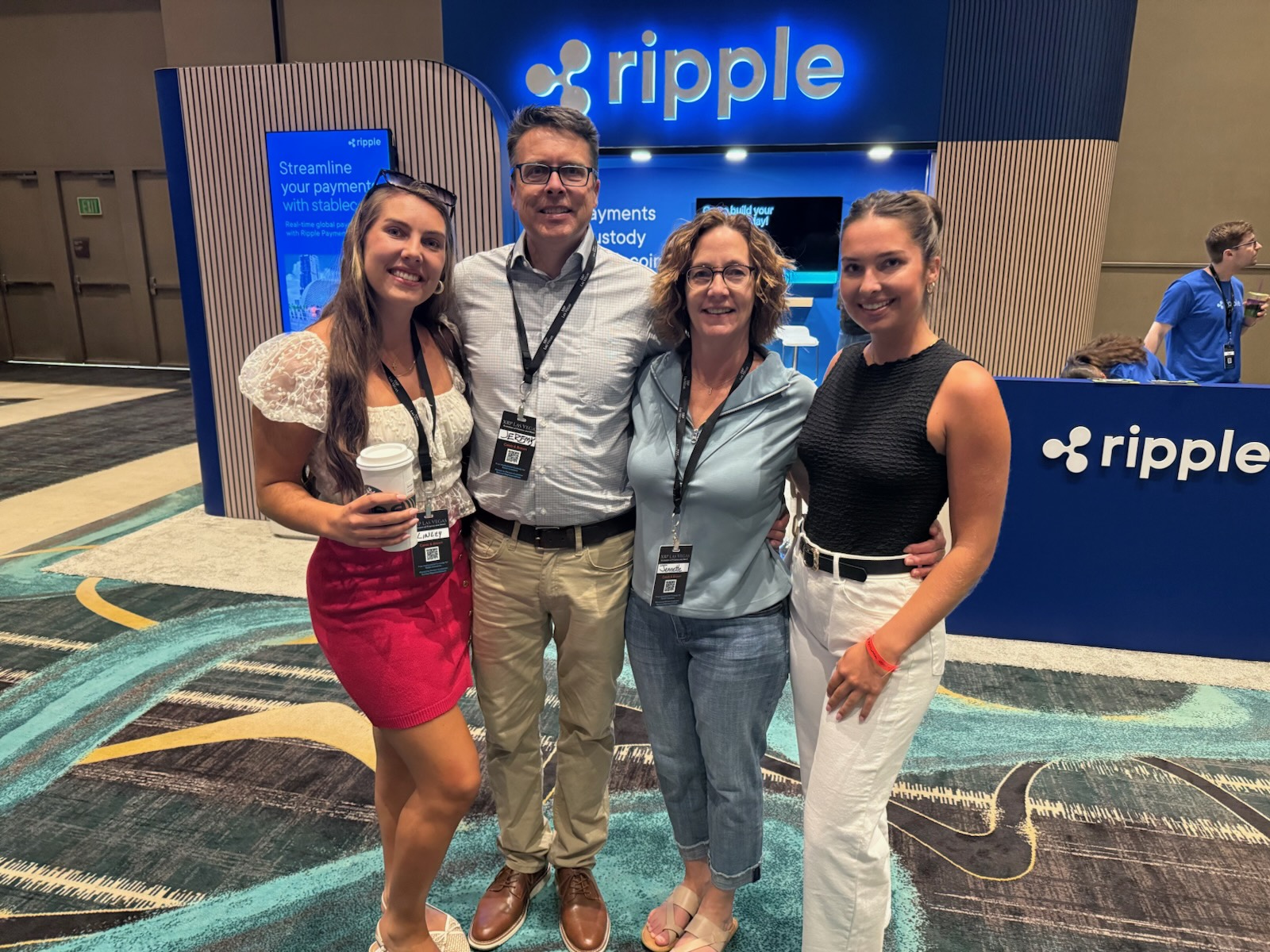 The Digital Asset Sisters team with family at the Ripple booth in Las Vegas