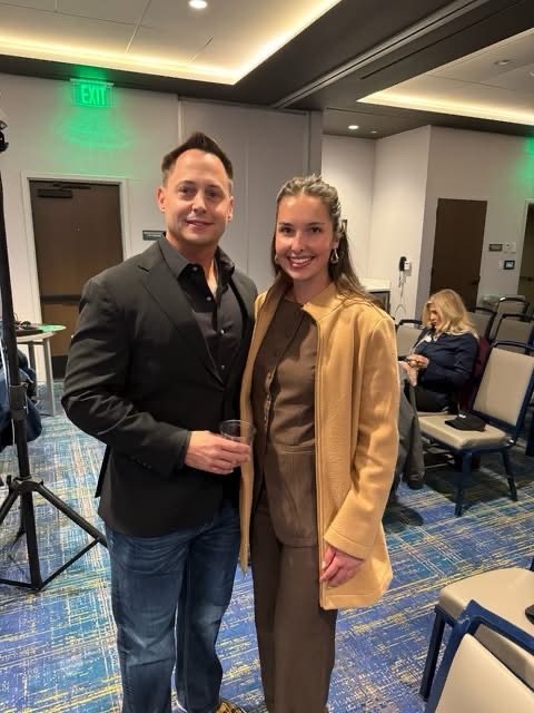 Kinley Coe with a colleague at a conference