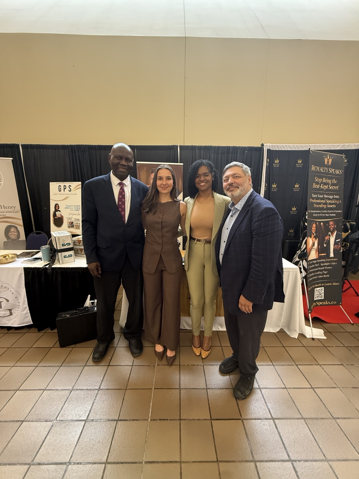 Kinley Coe with fellow speakers and vendors at a conference