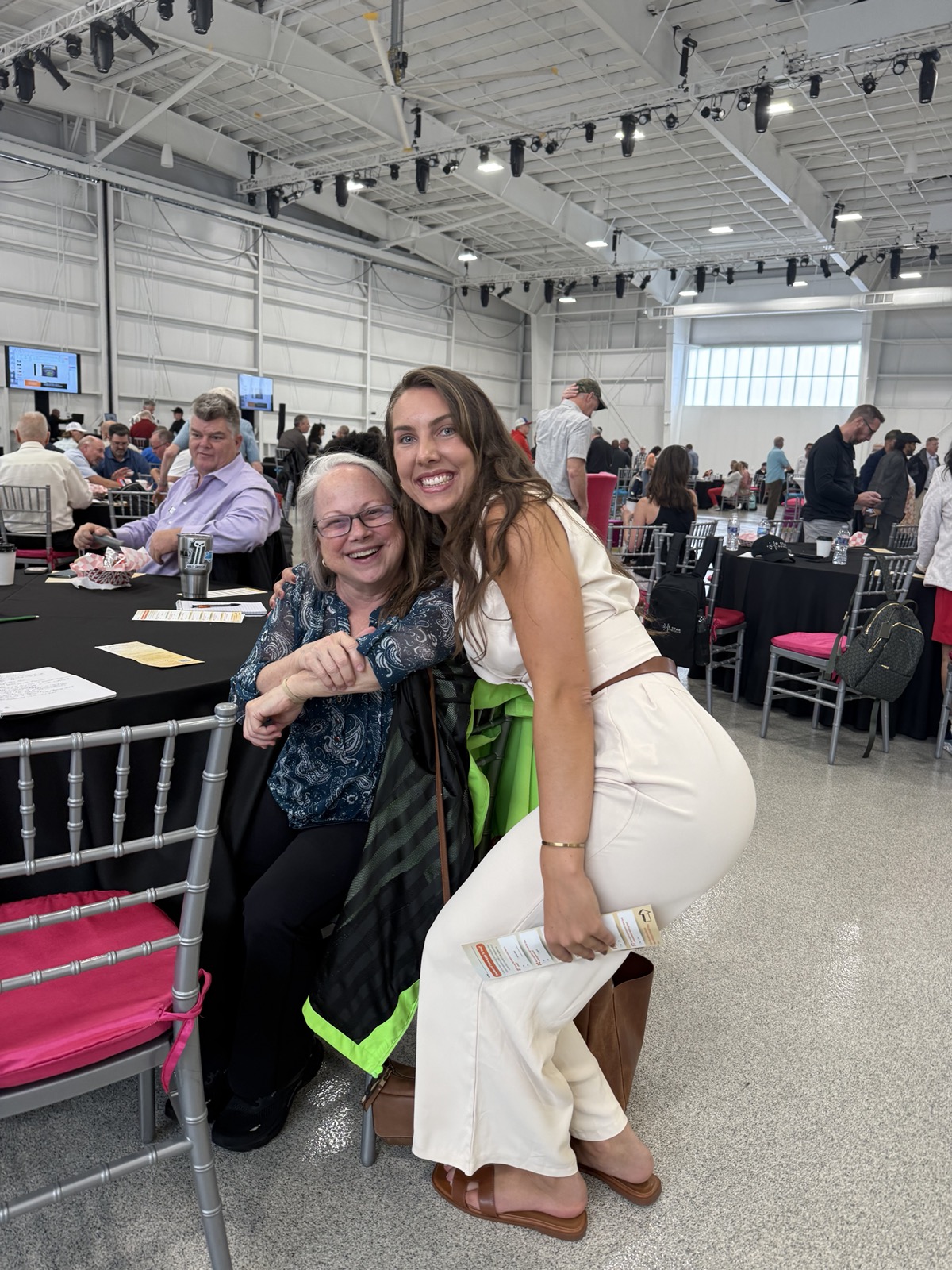 Kinley Coe with a client at an industry event