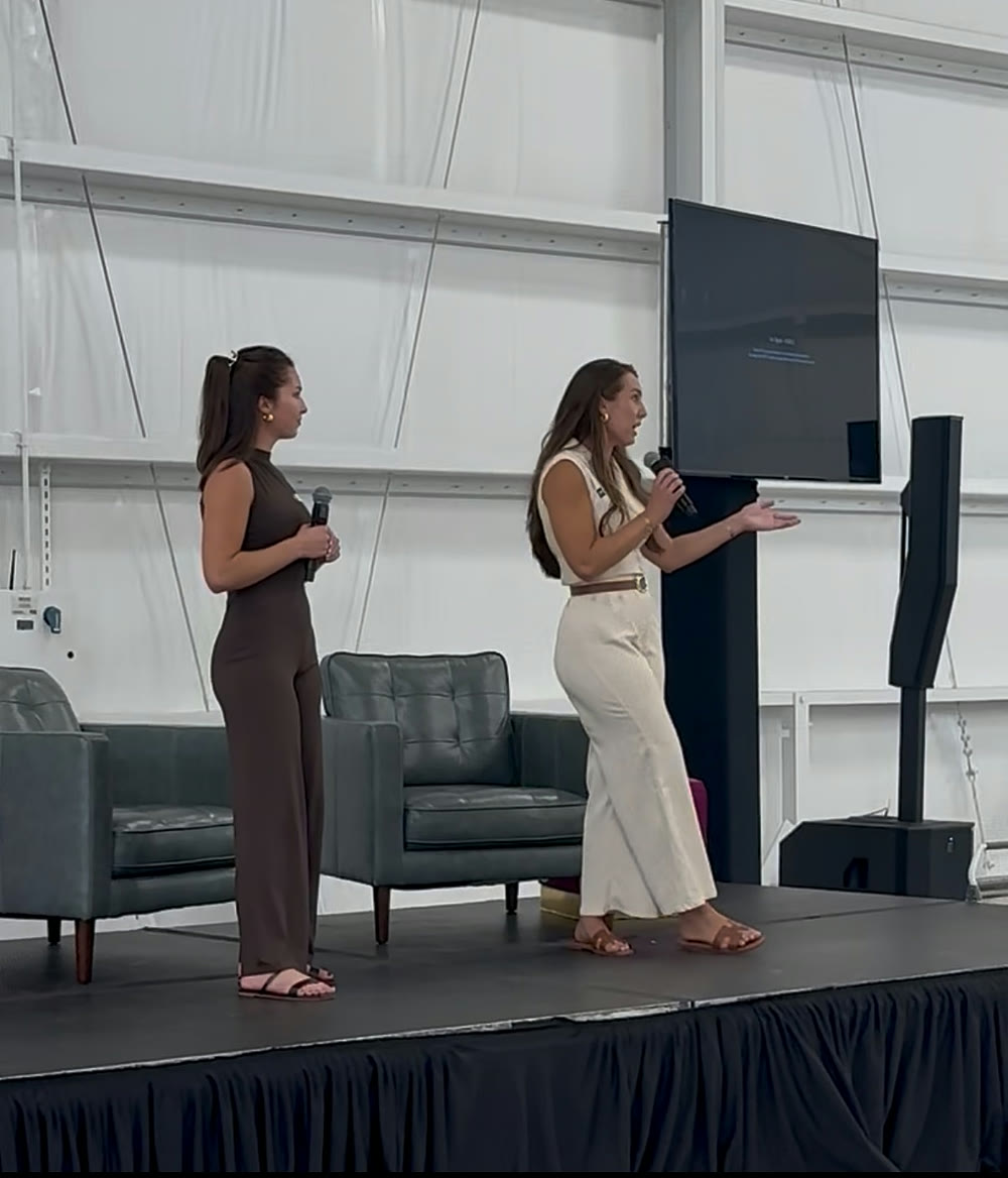 Kaelin and Kinley Coe presenting on stage